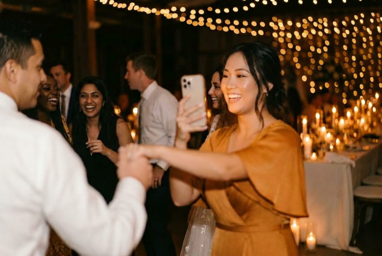 A guest capturing the dance floor on their phone